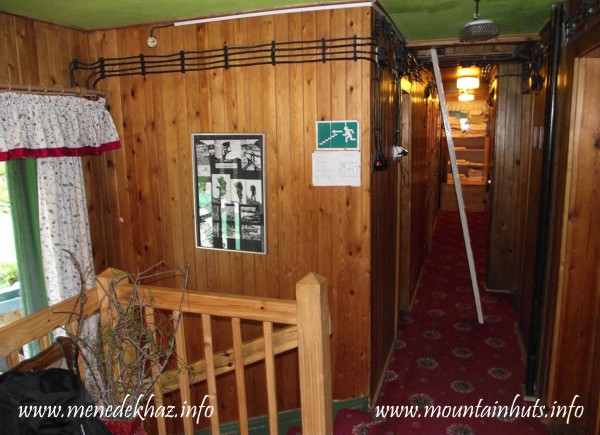 The upper floor with the white ladder to the attic The upper floor with the white ladder to the attic